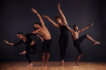 Image showing Performance, drama and portrait of group dancing, creative and art of body, moving and passion. Black background, men and women with pride, confident and people with balance, stage and ballet