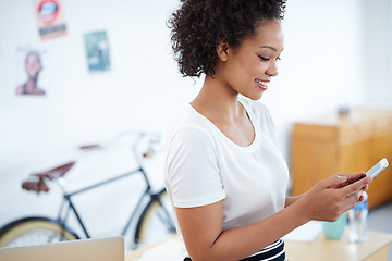 Image showing Young woman, phone and office planning for social media, online and communication in creative job or public relations. Happy African worker, employee or business person typing on mobile or networking