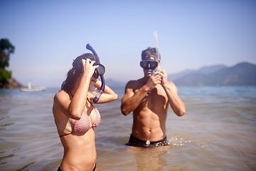 Image showing Scuba diving, water or couple swimming to explore for marine adventure, hobby or vacation activity. Mask, divers or people at sea, beach or ocean for travel, tropical environment or outdoor holiday