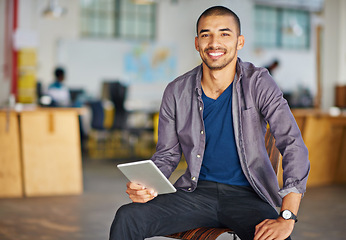 Image showing Tablet, office and portrait of businessman on chair for online research, website news and internet. Professional, startup and person on digital tech for networking, typing email and communication