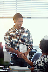 Image showing Business team, collaboration and handshake with success, and partnership in office. Website, teamwork and shaking hands at a desk with people and conversation for digital project at creative agency