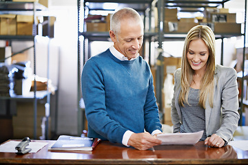 Image showing Document, warehouse and team of business people in discussion for shipping, storage and cargo. Factory, paperwork or logistics for inventory, stock or collaboration at table with happy senior manager