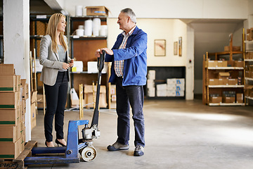 Image showing Man, woman and management in distribution warehouse, supply chain and logistics industry with pallet jack for boxes. Shipping, supplier and storage facility for delivery and inventory with discussion