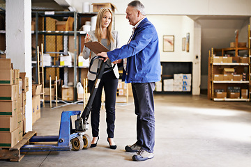 Image showing People, manager and discussion with clipboard for inventory management in warehouse, distribution and logistics industry. Checklist, inspection and pallet jack for boxes with supply chain and storage