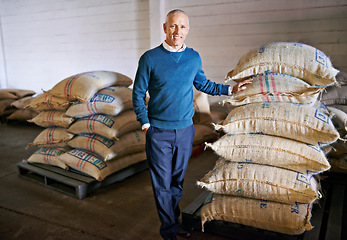 Image showing Coffee, factory and portrait of man with bag for distribution, quality control and confident logistics. Export, manufacturing and proud entrepreneur with beans at warehouse for sustainable business