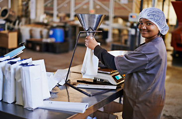 Image showing Business, worker and coffee beans packaging in factory with portrait, smile and manufacturing process. Production, woman and employee with bags, weighing tool and supply chain industry in warehouse