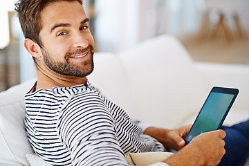 Image showing Relax, portrait or man with tablet for movies, streaming or watching fun videos on a film website in home. Smile, online or happy person with technology to download on app or reading ebook on couch