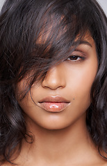 Image showing Woman, hair and beauty in portrait with hairstyle, salon treatment for texture and growth on grey background. Face, haircare and wellness for shine, cosmetology and change with cosmetics in studio