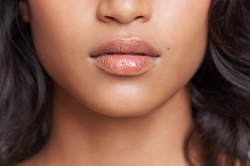 Image showing Woman, mouth and skin with natural beauty, skincare and wellness with gloss for dermatology closeup. Face, change and balm on lips for moisturizer, cosmetics and collagen with oil or serum for glow