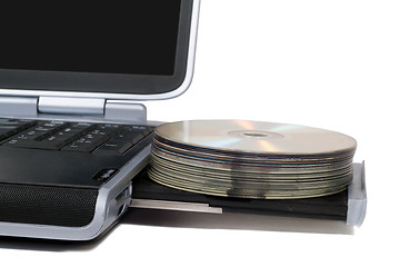 Image showing Laptop with overloaded DVD Drive. Isolated on white background