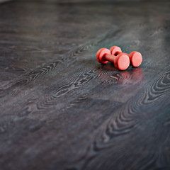 Image showing Dumbbells, home or gym with floor, exercise and workout for fitness and health or wellness. Equipment, weights and cardio for training, closeup and bodybuilding or weightlifting for muscle strength