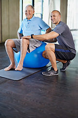 Image showing Physiotherapist, portrait and senior man with ball, training and elderly support for care. Men, gym and exercise for health, wellness and coaching with arthritis for mature rehab and wellbeing