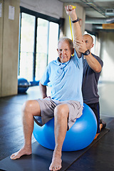 Image showing Physiotherapist, helping and senior man with elastic, training and elderly support for care. Men, gym and exercise for health, wellness and coaching with yoga ball for mature rehab and wellbeing