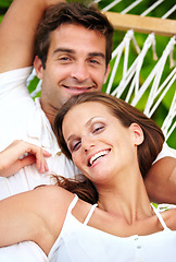 Image showing Portrait, happy couple and relax on hammock in nature, love and vacation in summer on tropical island. Young man, woman and face in marriage at beach resort, peace and holiday for leisure outdoor