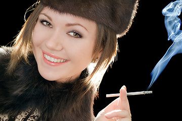 Image showing Portrait of the smiling young woman with a cigarette