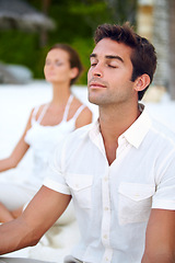 Image showing Yoga, meditation and couple at beach to relax for stress relief, wellness and mindfulness for calm peace. Zen, ocean and people on holiday vacation for spiritual healing, mental health or marriage