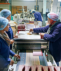 Image showing Workers, printer and machine in factory for paper, system and industry for manufacturing and distribution. Woman, stock and control with production for assembly line, printing and supplier for job