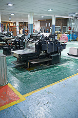 Image showing Machine, production and factory for industry and manufacturing for distribution in warehouse. Metal, equipment for stock, assembly line and printing process for supply chain and system control