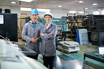 Image showing Business, partners and printing machine with smile or confident in factory for supply and distribution. Portrait, people and arms crossed in happiness at warehouse with packaging technology.