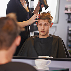 Image showing Mirror, hairdryer and man with hairdresser for professional haircare, styling or drying with luxury treatment. Grooming, hair and client at salon for care, wellness and small business with service