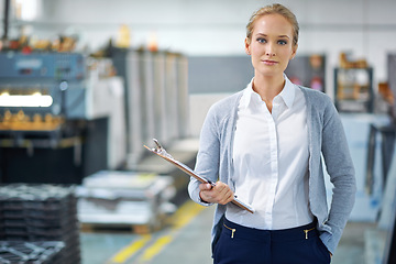 Image showing Woman, clipboard and factory in portrait for logistics with quality assurance in facility for inventory. Confident female person, checklist and manufacturing with storage, industry and distribution