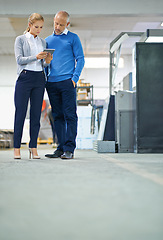 Image showing Mature, man and woman with tablet in factory for production monitoring, inventory or order management and inspection. Team, digital tech and warehouse for printing material and distribution industry.