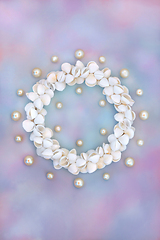 Image showing Oyster Pearl and Cockleshell Sea Shell Wreath on Rainbow Sky