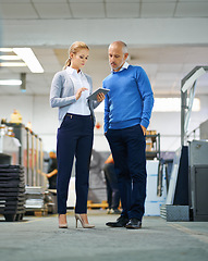 Image showing Mature, man and woman with tablet in warehouse for production monitoring, inventory or order management and inspection. Team, digital tech and factory for printing material and distribution industry.