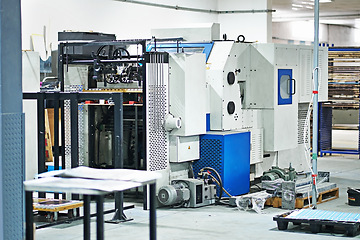 Image showing Factory, printing and production in manufacturing, packaging and industry in background. Equipment, machine and distribution plant for technology, offset at workshop for industrial trade in warehouse