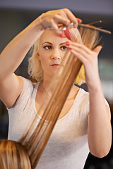 Image showing Hairdresser, hands and woman with scissors for haircut, styling and beauty treatment with hair care maintenance. Grooming, cosmetic and stylist at professional salon with client, pamper and makeover