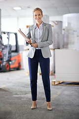 Image showing Businesswoman, suit and smile with clipboard in warehouse for paperwork and administration. Portrait, female person and happy for stock or information capture in logistics company as entrepreneur