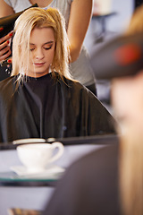 Image showing Woman, hairstylist and dryer in salon, mirror and heat treatment or haircare for grooming. Female person, beauty and appliance for transformation at hairdresser, cosmetics and equipment for texture