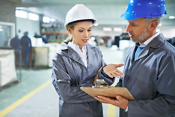 Image showing Man, woman and discussion with checklist in factory for quality inspection or safety checks and process monitoring. Team, inventory and clipboard for manufacturing information in printing warehouse.