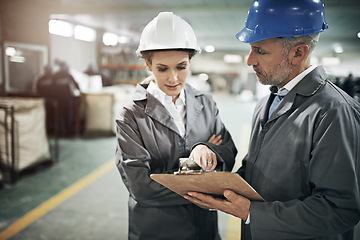 Image showing Man, woman and checklist with clipboard in factory for quality inspection or safety checks and process monitoring. Team, communication and board for manufacturing information in printing warehouse.