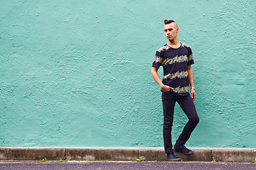 Image showing Man, confidence and serious outdoors for fashion, weekend and casual style for hipster trend. Male person, travel and mockup space by wall background, aesthetic and streetwear or clothes for attitude