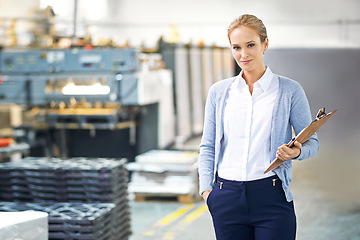 Image showing Business, clipboard and woman in suit in warehouse with production, paperwork and administration. Portrait, female person and confident with stock or information capture in logistics company