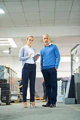 Image showing Portrait, man and woman with tablet in factory for production monitoring, inventory or order management and inspection. Team, digital tech and warehouse for printing material and manufacturing.