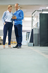 Image showing Senior, man and woman with tablet in warehouse for production monitoring, inventory or order management and inspection. Team, digital tech and factory for printing material and distribution industry.