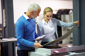 Image showing Printing industry, tablet and people with paper for communication in creative sector, warehouse and factory for design project. Teamwork, man and woman talking, technology and quality check of work