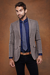 Image showing Suit, style and portrait of man in studio with confidence for trendy, classy and stylish outfit. Cool, fashion and male model with pride for elegant, fancy or luxury clothes by brown background.