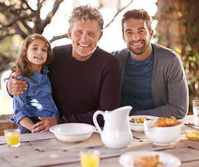 Image showing Outdoor, portrait and father with grandpa of girl, smile and breakfast on table in backyard of house. Home, men and child with happiness for visit to grandparent for holiday, family and love