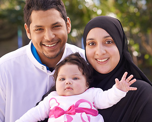 Image showing Muslim family, park and portrait of parents with baby for bonding, smile and outdoors together. Islam, happy and mother, father and newborn infant for love, childcare or support in garden