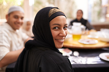 Image showing Muslim woman, portrait and family at home with dinner, celebration and Ramadan at the dining table. Islamic people, culture and religion with food, drinks and Iftar for breaking fast at sunset