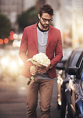 Image showing City, man and bouquet of flowers with thinking for romantic gesture, love or gift in New York. Male person, downtown and bunch of roses with idea for kindness, planning or present on valentines day