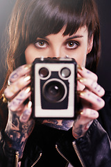 Image showing Person, hands and camera with tattoo for vintage, polish and creative for ink and design for picture and symbol. Art, bold and portrait for cool and capture for photographer, trend, edgy and gold