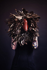 Image showing Halloween, skull and woman with tattoo in studio scary aesthetic, artistic horror or abstract mask on dark background. Surreal, nightmare and bones with leaves for creative, culture or unique person