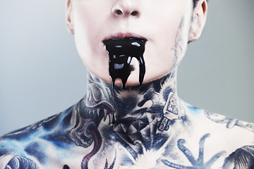 Image showing Person, ink and drip for mouth with tattoo for creative, body and design in studio, pattern and horror. Art, bold and punk for symbol on skin for paint, liquid and unique for nightmare and scary