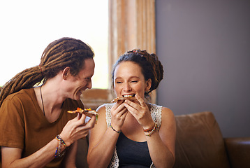 Image showing Food, happy and love for couple, couch and living room in home. Dreadlocks, smile and eating pizza for romance and affection on weekend, house or lounge or partner together for bonding on holiday