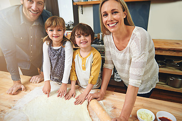 Image showing Portrait, smile and family baking in kitchen together, bonding and happy for learning in home. Face, mother and father with kids cooking pizza, teaching and help parents with flour dough at table