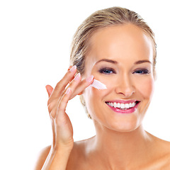Image showing Portrait, cream and skincare of happy woman for beauty, body or health isolated on a white studio background. Face, lotion and blonde model apply cosmetics for dermatology, wellness or makeup product